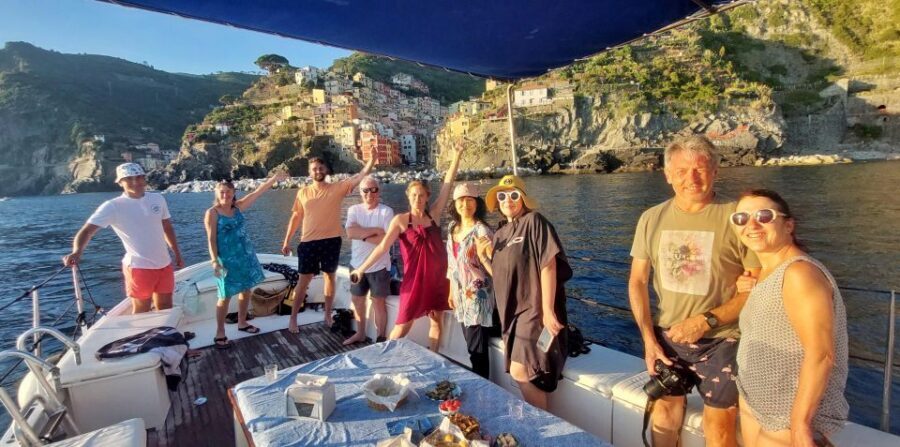 Cinque Terre: Sunset Boat Tour on Traditional Ligurian Gozzo - Swim time in boat-only bays: clear water and optional snorkel gear