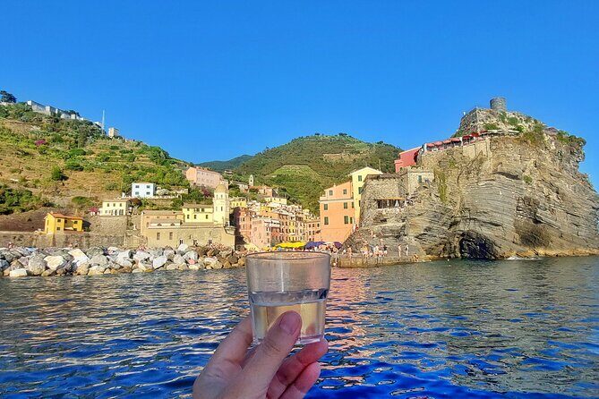 Cinque Terre tour with a traditional ligurian gozzo from Monterosso - Photo and sightseeing stops off Vernazza, Corniglia, Manarola, Riomaggiore, and Punta Mesco